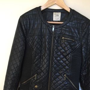 Zara Black color leather jacket.